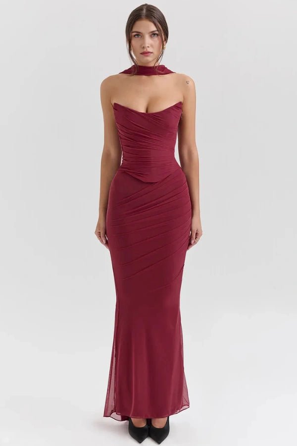 Model wearing the Hailey burgundy ruched mesh maxi dress with matching detachable choker by Kouvr, front view.