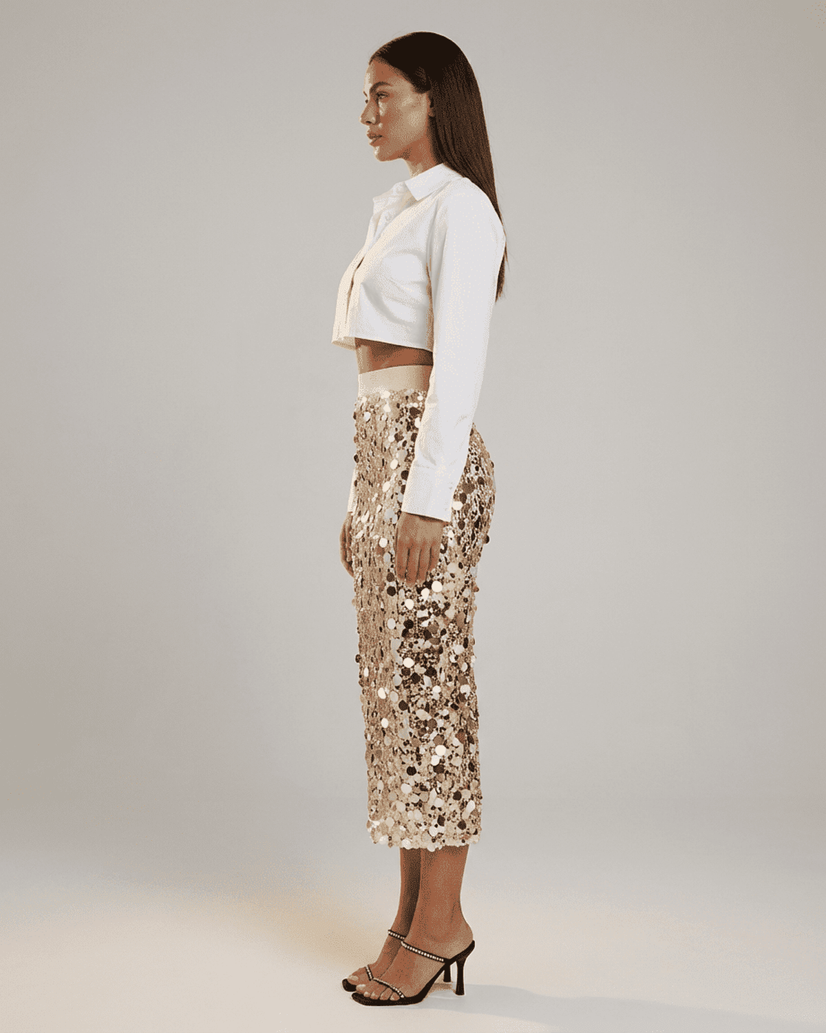 Aureline Midi Skirt by Lauven: Sequin high waist bodycon midi skirt showcased on model in profile view.