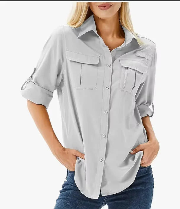 Light gray women's UPF 50 long roll-up sleeve hiking safari shirt with zip pockets.