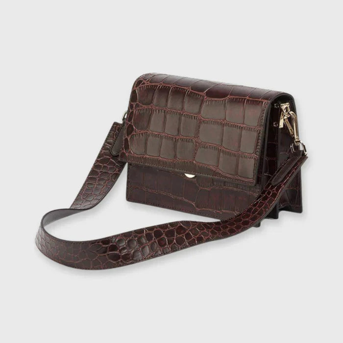 Brown crocodile-print shoulder bag side view