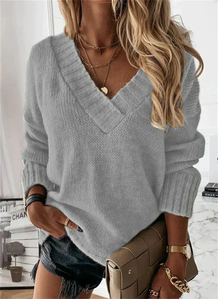 Elegante jersey de cuello de pico para mujer