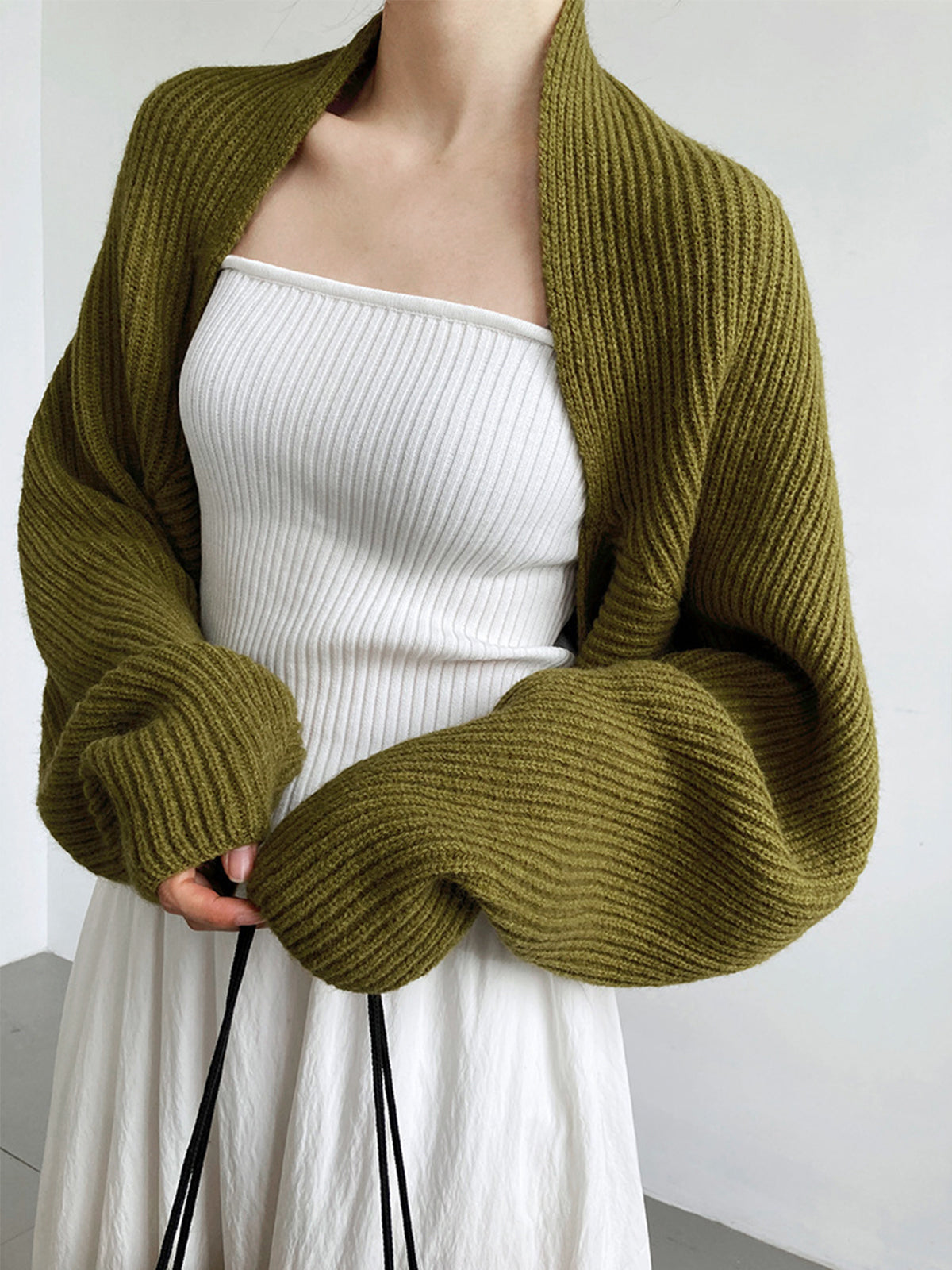 Olive green knit shrug with balloon sleeves front view