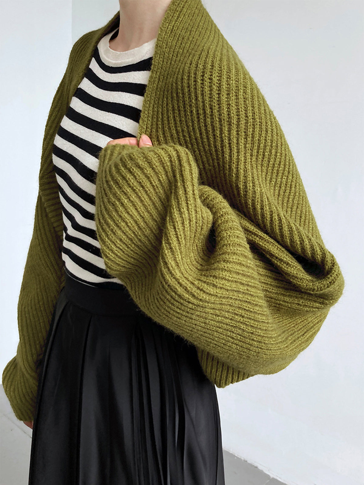 Olive green knit shrug with balloon sleeves side view