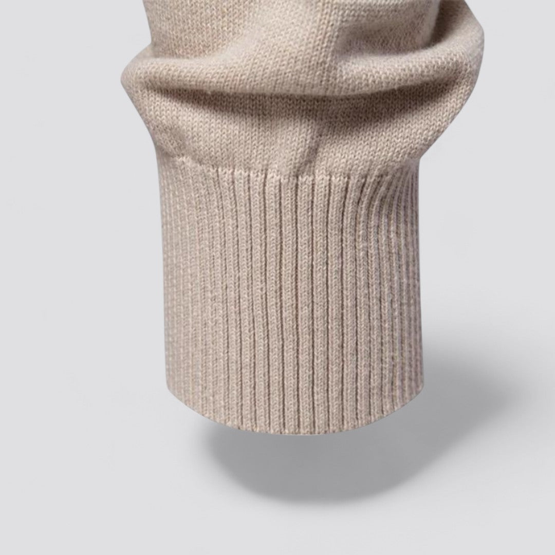Manica maglione beige in lana, dettaglio polsino a coste, tessuto morbido e caldo, moda autunno inverno, abbigliamento casual elegante.
