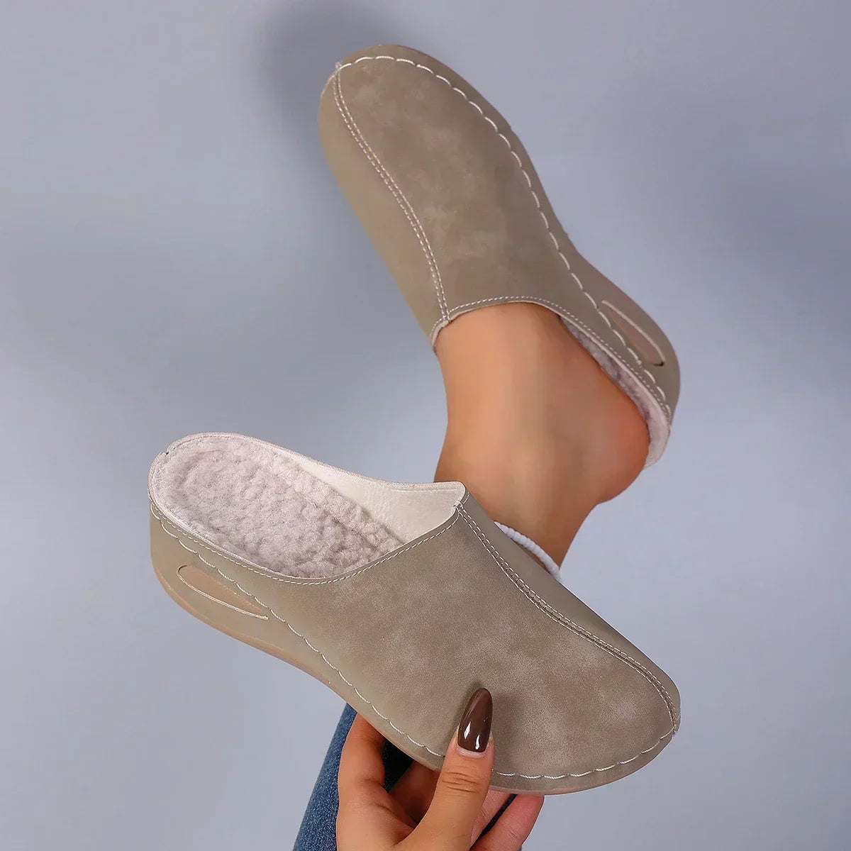Blue suede-effect slippers with fleece lining and slip-on silhouette for relaxed indoor footwear