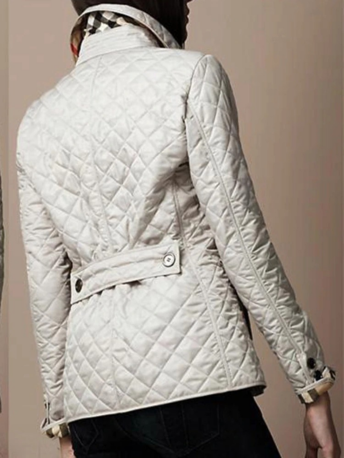 Close-up of a ladies' casual quilted jacket featuring a stylish turned-down collar & snap buttons.