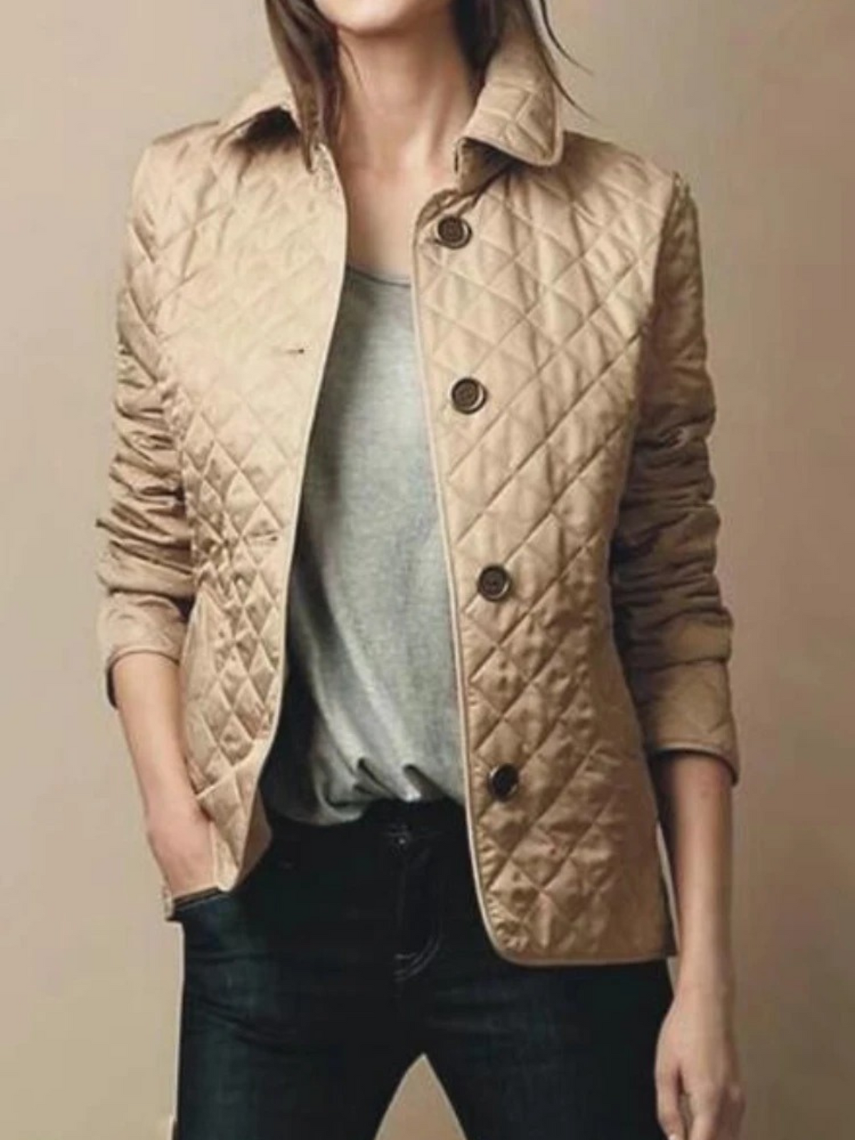 Versatile women's quilted jacket, a warm layering piece with a turned-down collar for casual wear.