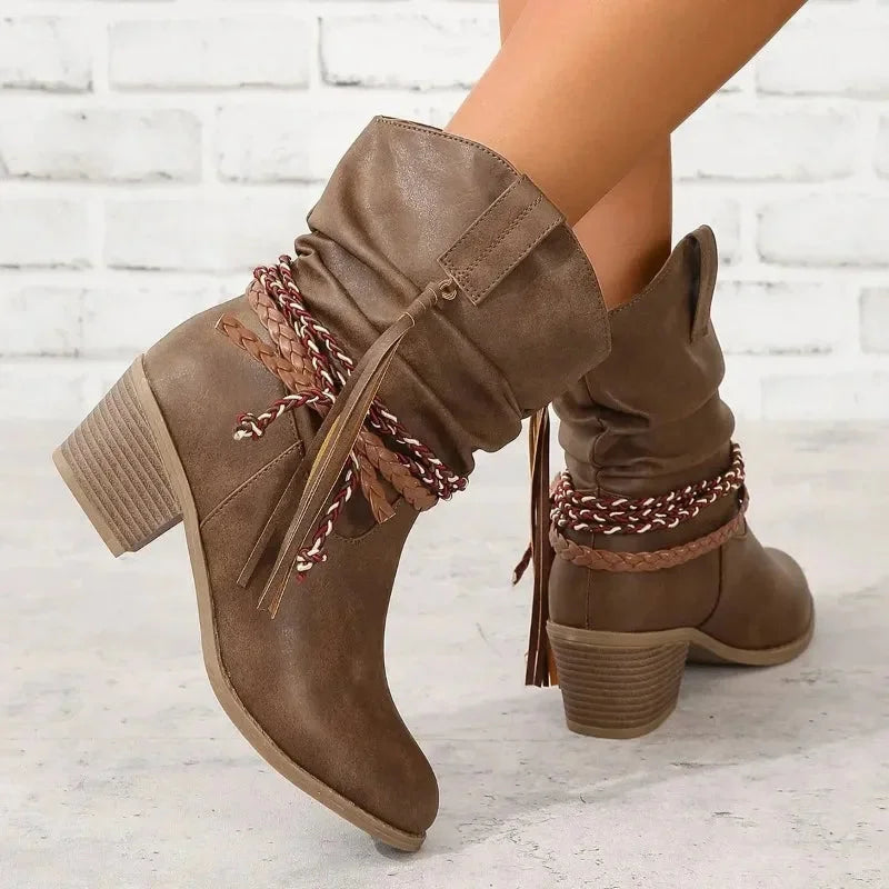 Brown western slouchy boots, braided tassels, stacked heel.