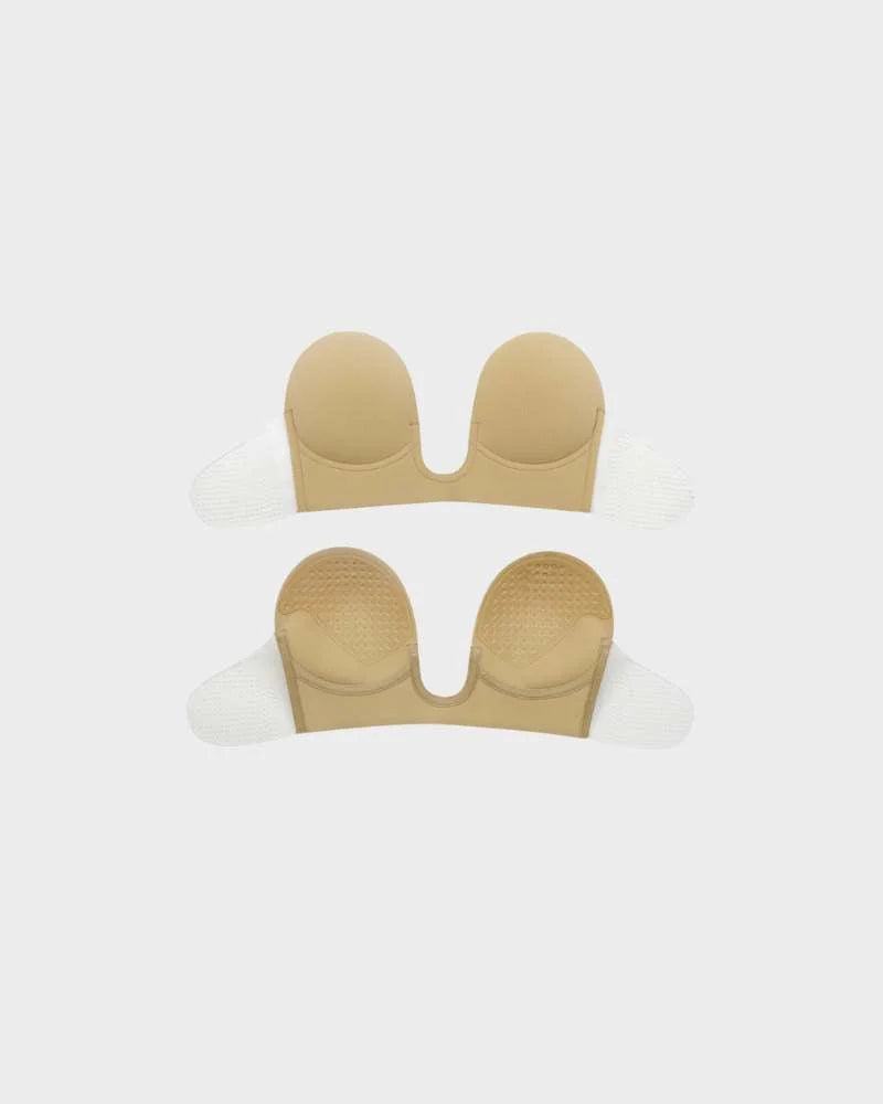 Self-adhesive strapless backless U-plunge bra for lift.